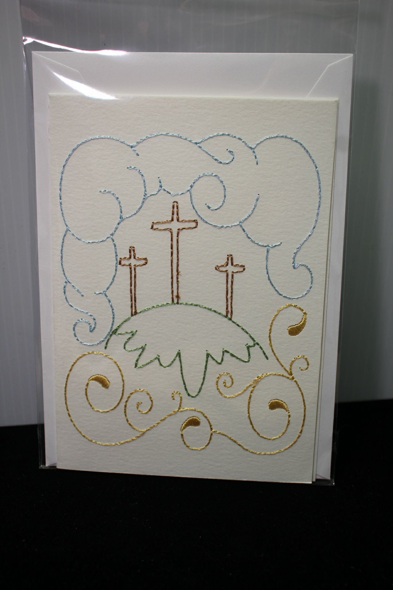 Embroidered Greeting Card Featuring Three Crosses on a Hill w/ Clouds and Swirls